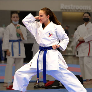 young adult in karate stance